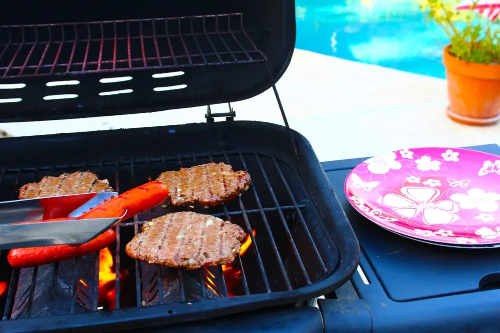 grilling burgers and hot dogs on 4th of July