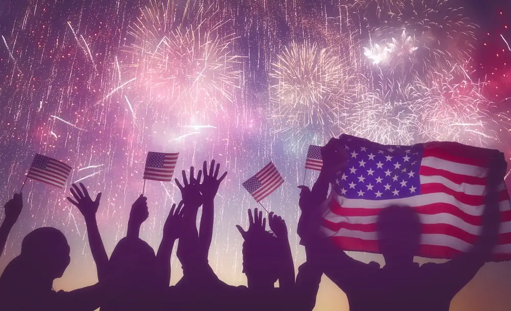 celebrating 4th of July with fireworks and American flags